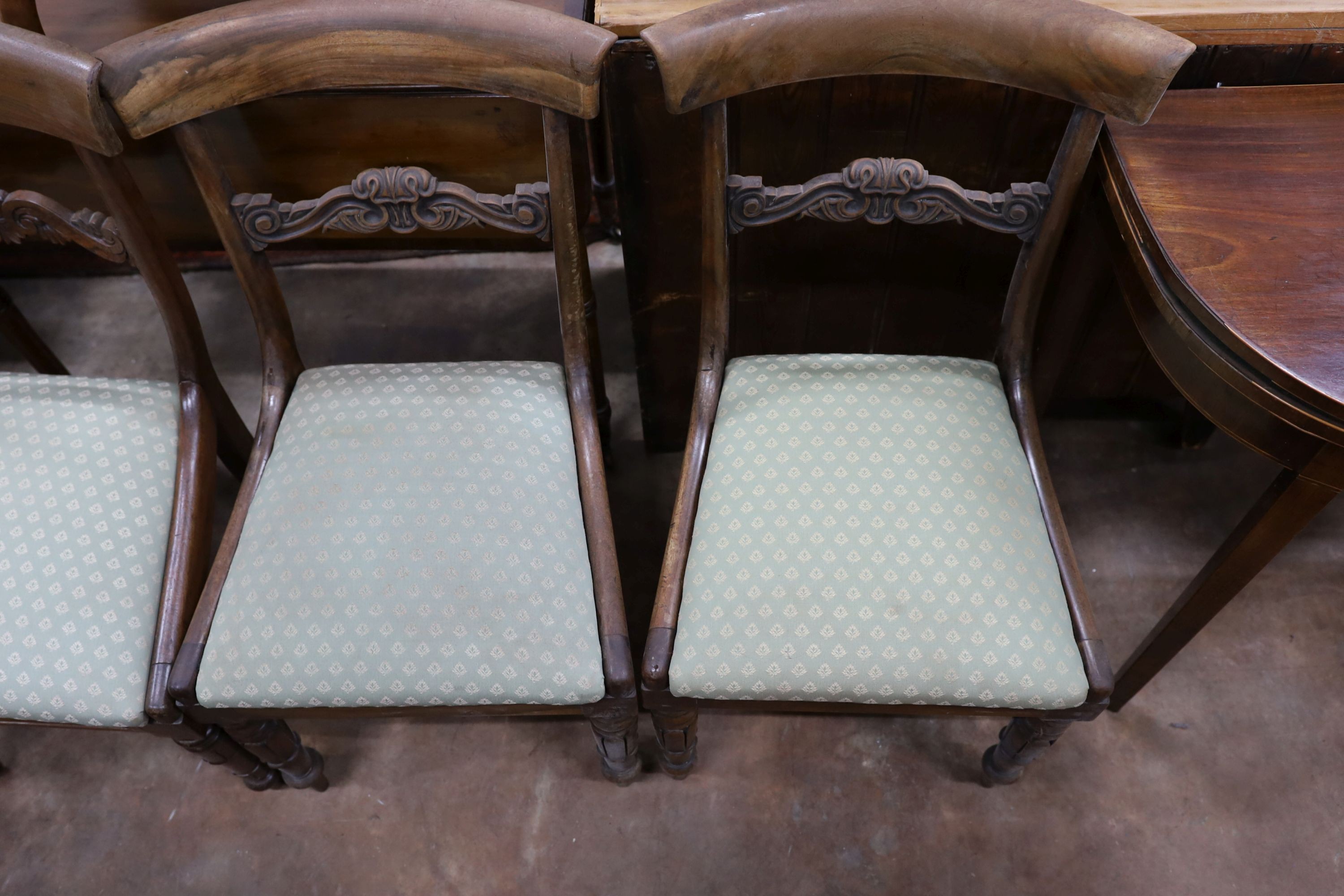 Two pairs of William IV mahogany and simulated rosewood dining chairs